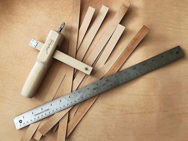 leather straps and cutting tool with a ruler