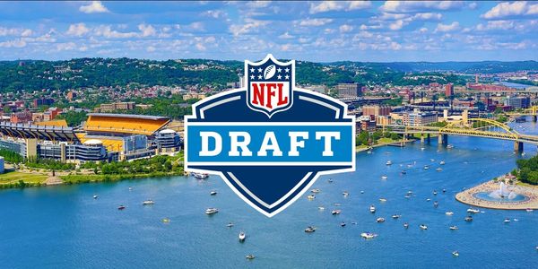 Aerial view of a riverside city with an NFL Draft logo overlay.