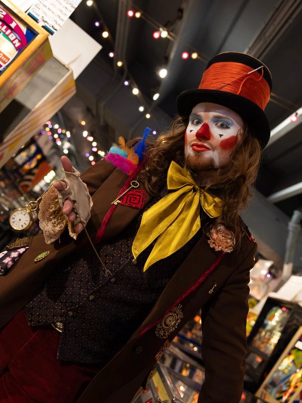 Clown with colorful makeup and vintage outfit.