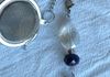 Charm made by Sharon shown here as a tea-strainer charm. Can be clipped to anything for bling.