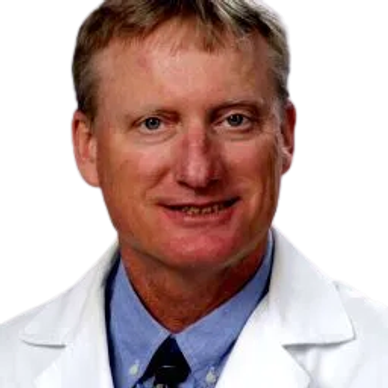 Man in a white lab coat with a blue shirt and tie.