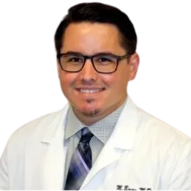 Smiling doctor in white coat and glasses.