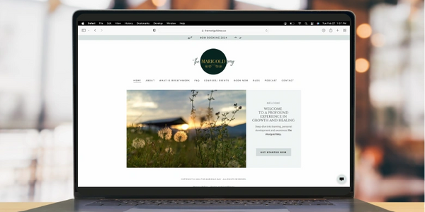 Laptop on desk with open website build for the Marigold Way on screen.
