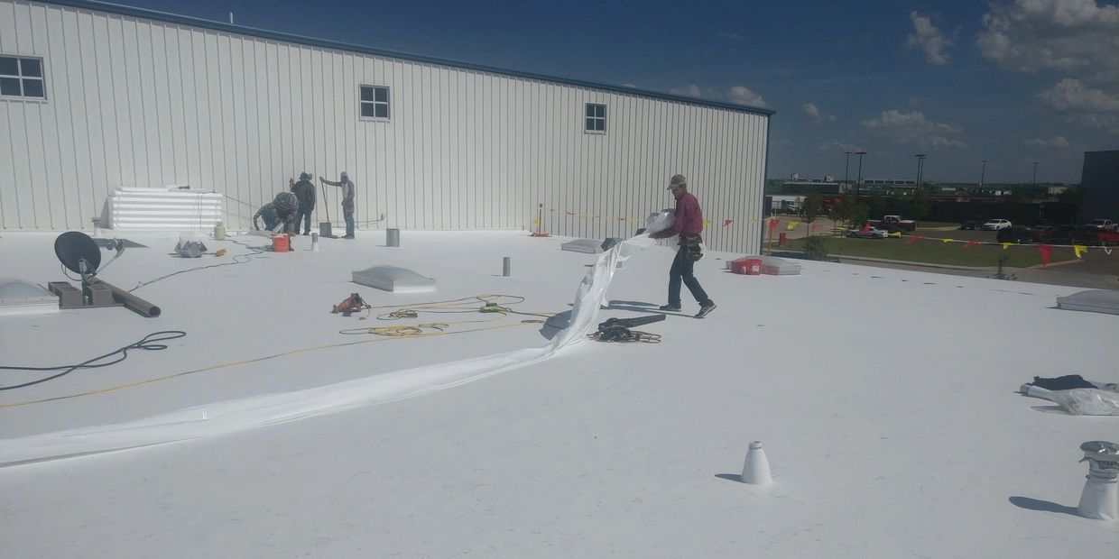 Norton Roofing installing a TPO commercial roof system at Micro Technologies in Amarillo, Texas.