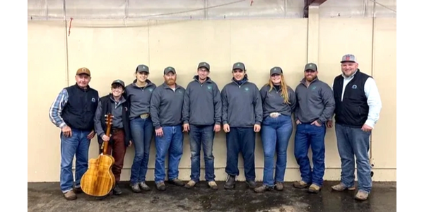 Group of people standing for Mission Farrier School class photo at the end of the session.