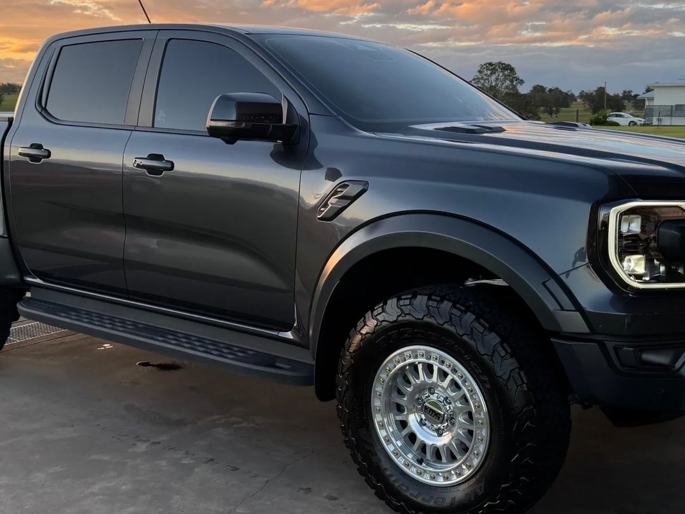 Ford Raptor truck parked at sunset