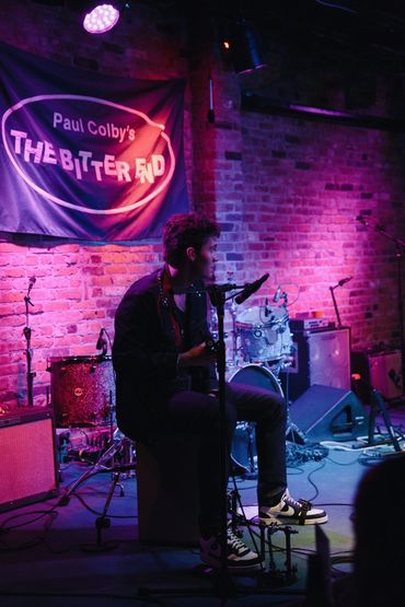 Musician playing at Paul Colby's The Bitter End.