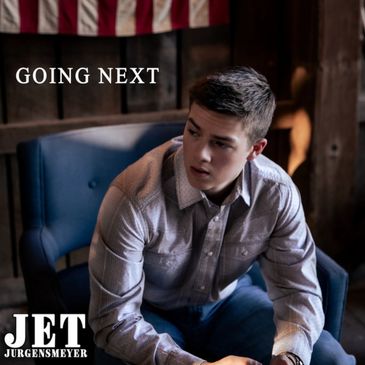 A young man sitting thoughtfully on a chair.