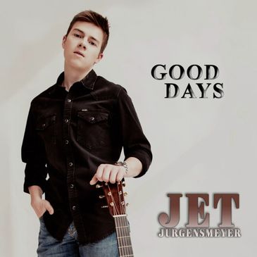 Young man posing with guitar and album title.