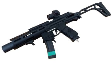 Black airsoft gun with a tactical design and green tape on the magazine.