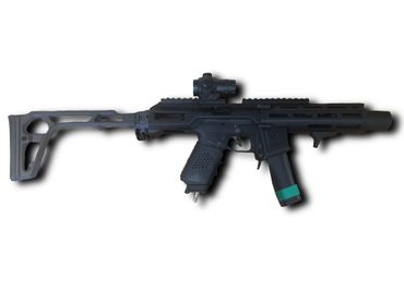 A black airsoft gun with a collapsible stock and mounted scope on a white background.