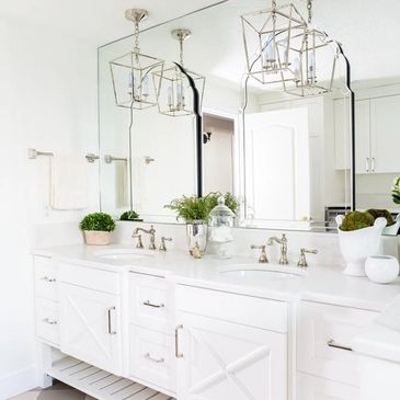 Bright master bathroom with double white vanity.
