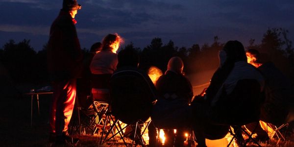 people around campfire