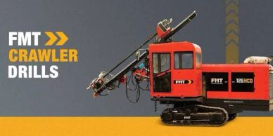 FMT crawler drill machine isolated on gray and yellow background.