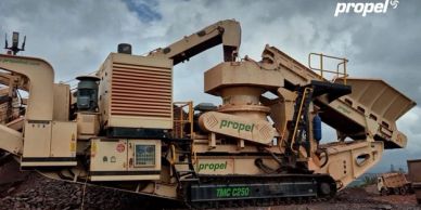 Heavy industrial stone crusher machine in a quarry.