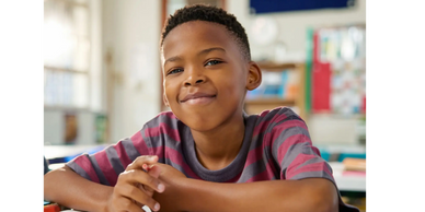 A young boy smiling