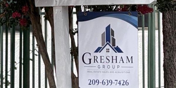 Sign for Gresham Group real estate company.