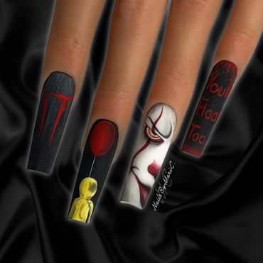 Horror-themed nail art inspired by the movie 'It' with detailed character designs and bold colors.