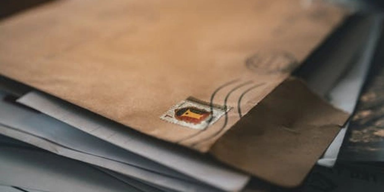 A stack of opened physical mail.