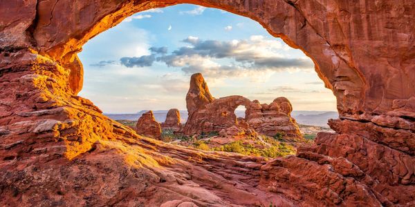 Scenic rock formation viewed through an arch.