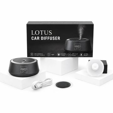 Black Lotus car diffuser with accessories and packaging on white stands.