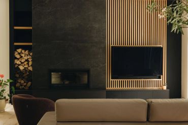 Modern living room with fireplace and TV.