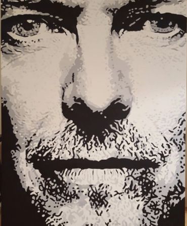 Close-up grayscale artwork of a man's face.