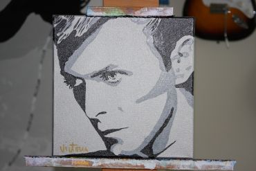 Black and white portrait painting of a man with intense eyes.