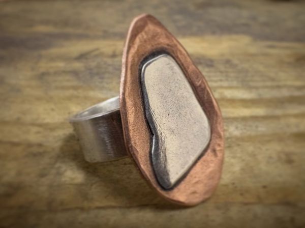 A sterling silver and copper statement ring