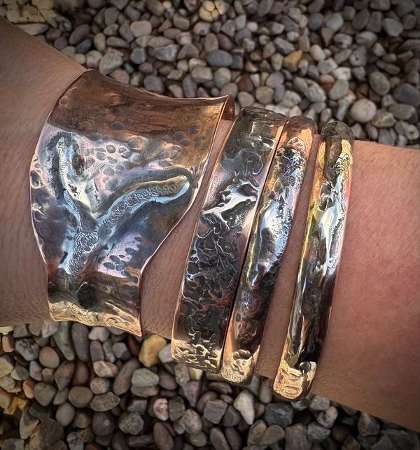 Four fused bangles and cuff bracelets