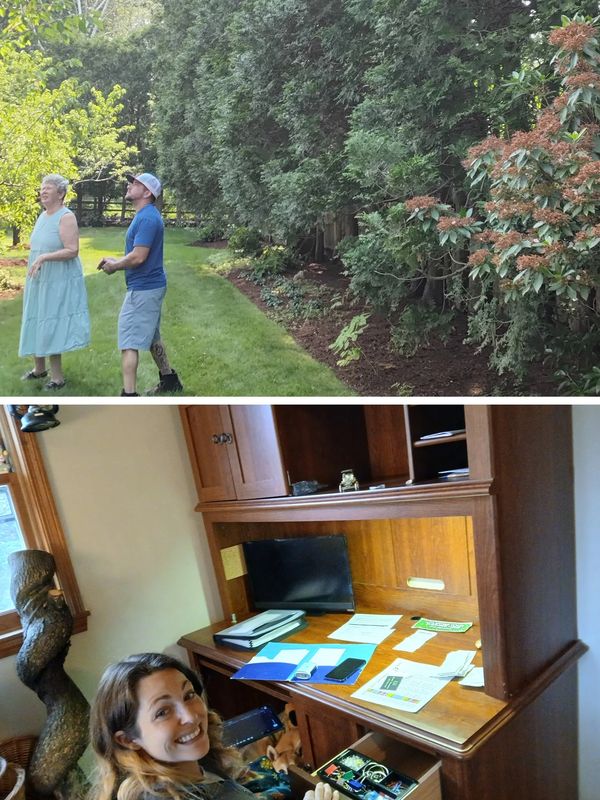 Two people standing outside by tall bushes in a garden.
