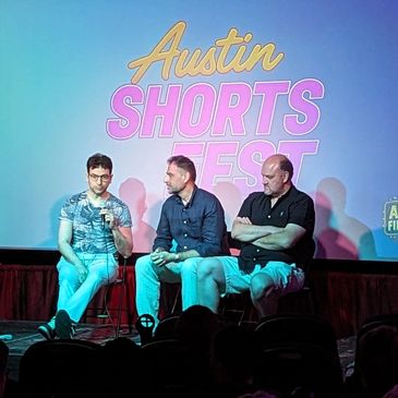 Three men speaking on stage at Austin Shorts Fest.