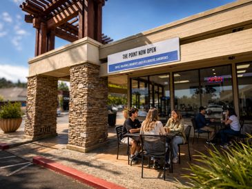 People enjoy outdoor seating at The Point, a newly opened cafe and restaurant.