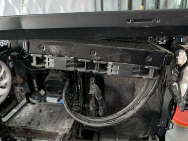 Inside view of a computer with disconnected graphics card.