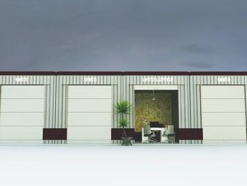 A modern industrial building with three garage doors and an open office space in the middle.