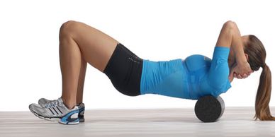 Lady performing a foam rolling exercise