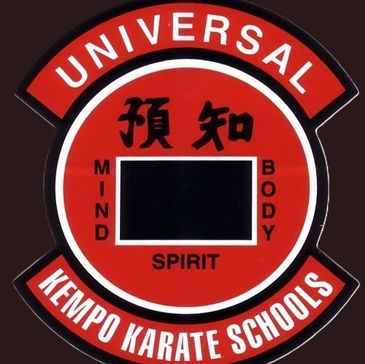 Emblem of Universal Kempo Karate Schools featuring mind, body, and spirit.