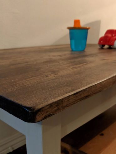 Close up of children's desk with rounded edges for safety.