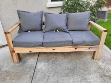 Front view of 3 seater redwood outdoor couch.