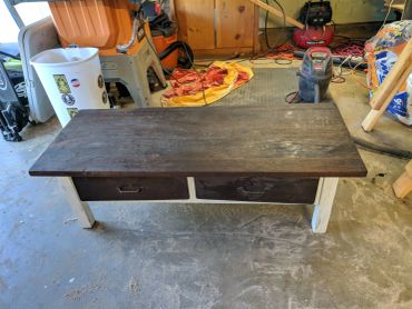 Coffee table with walnut stain top and white body.