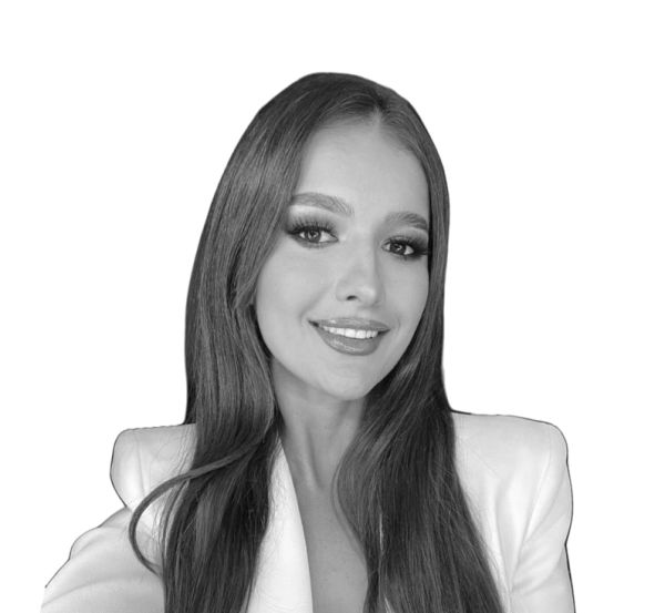 Young woman with long hair smiling.