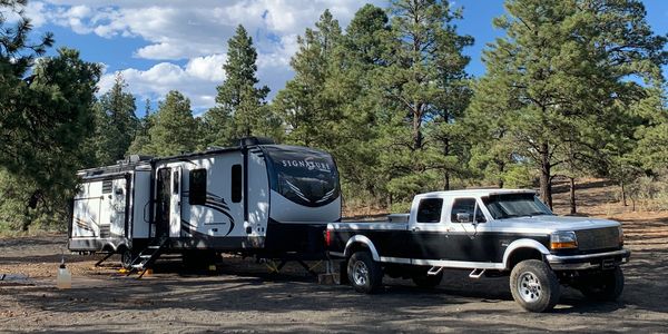 truck and rv trailer parked in Flagstaff cinder hills off highway vehicle area