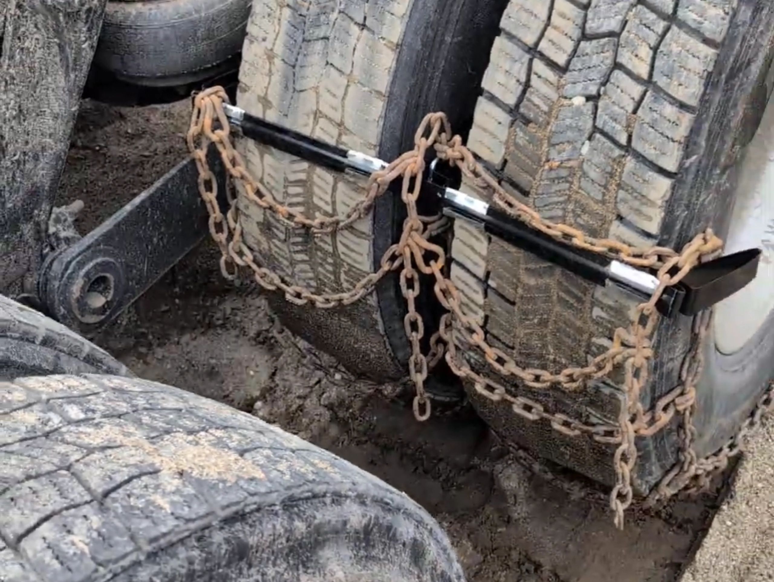 Chain beneath the ChainCheater is held tight to the tire, eliminating pouch sag upon initial roll on