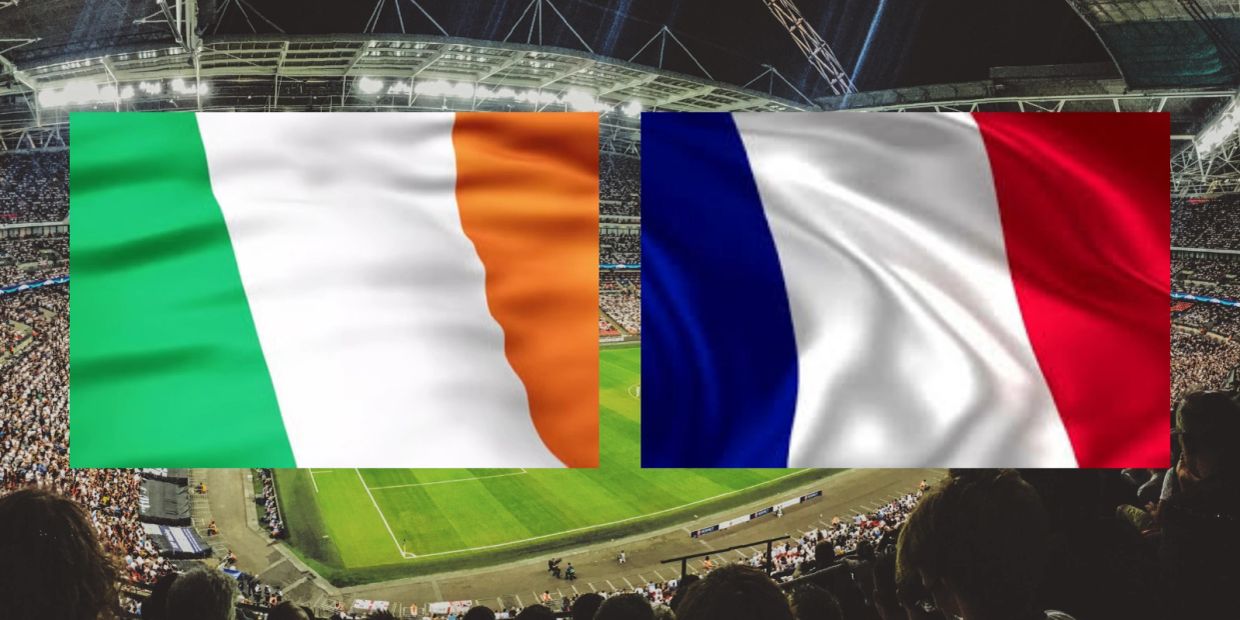 Irish and French flags side by side at a crowded sports stadium.