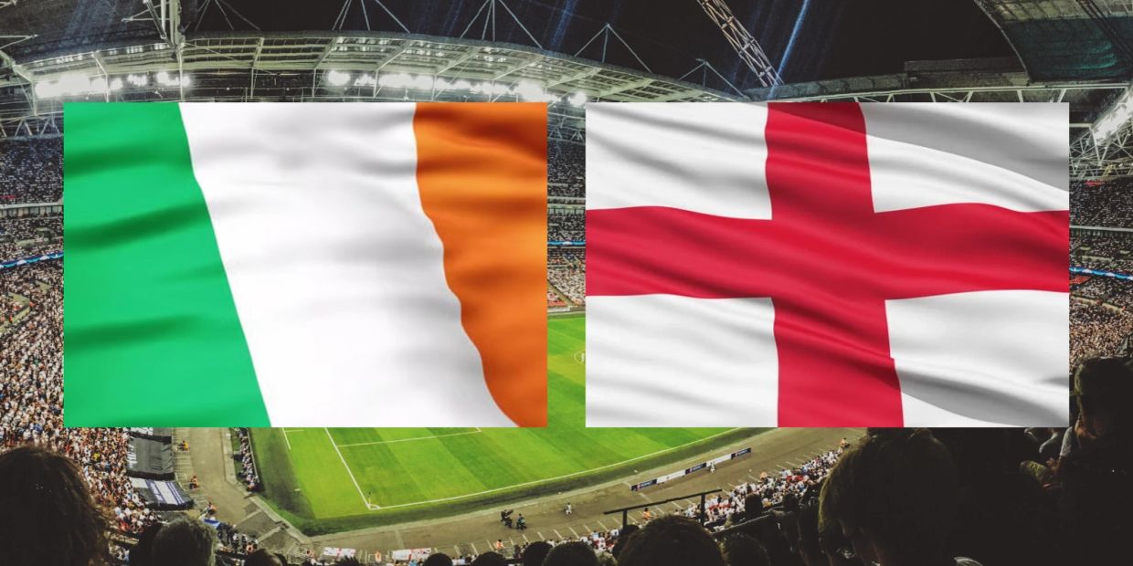 Ireland and England flags over a crowded football stadium.