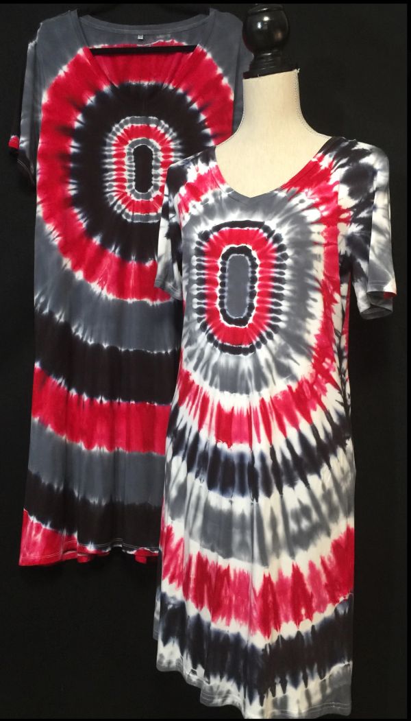 Two tie-dye dresses with red, black, and white concentric patterns.