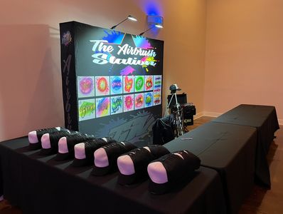 Premium Airbrush party favors event set up