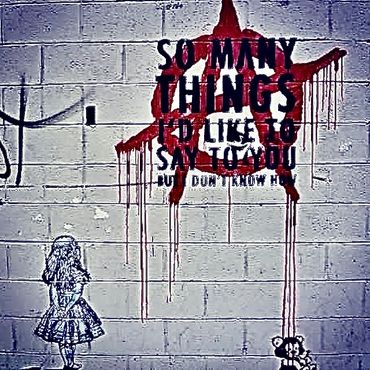 Wall art of a little girl with a teddy bear looking at an anarchy symbol with the lyrics from a song