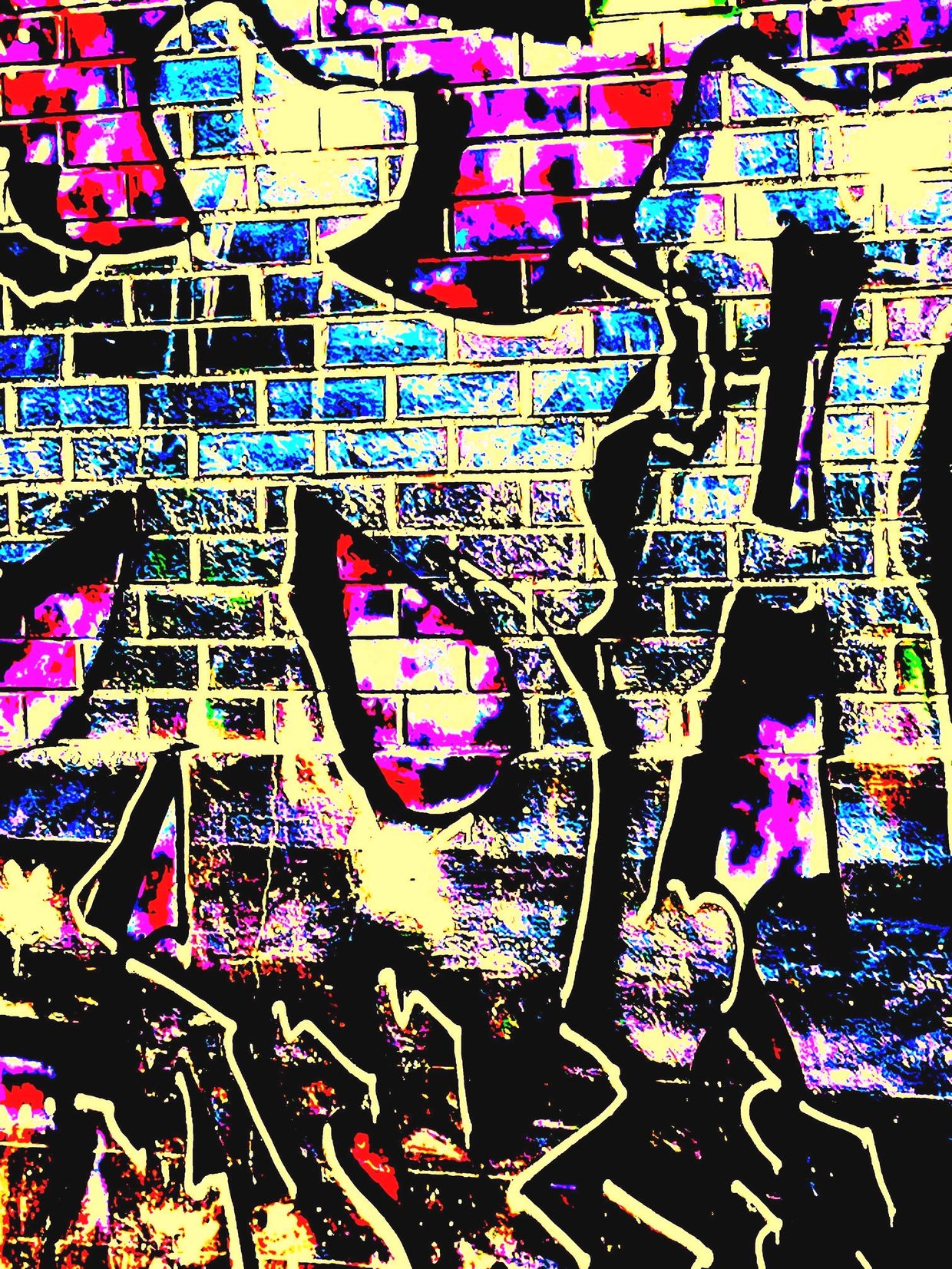 Colorful graffiti art on a brick wall with vibrant outlines.
