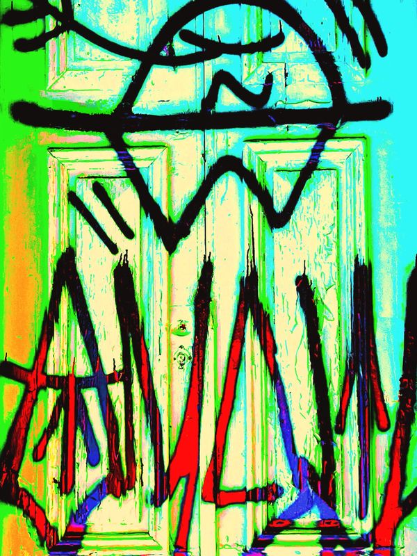 Colorful graffiti art with abstract shapes on a door.